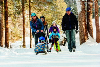 Ice skating in the forest is a great activity for a family day trip.