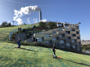 Green mats lead the skiers from the roof of the building all the way into the valley.