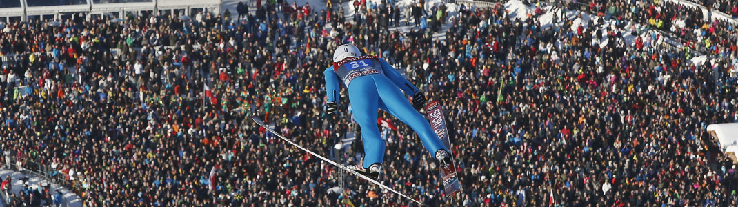 Many spectators in the stadiums at the Four-Hills-Tournament.