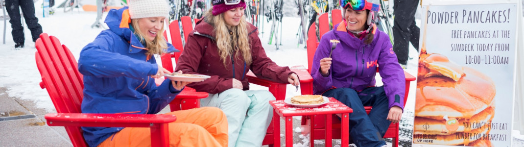 Skiers enjoy free pancakes with fresh snow in Aspen.