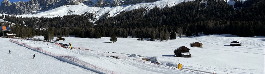 The Carezza Snowpark is set against a magnificent mountain backdrop.