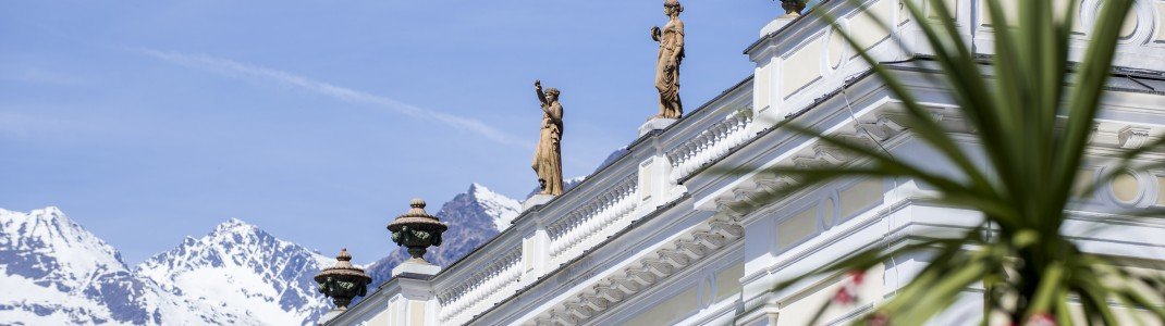 Mediterranes Klima in der Kurstadt Meran: Wo der Blick von der Palme in die weißen Berggipfel reicht.