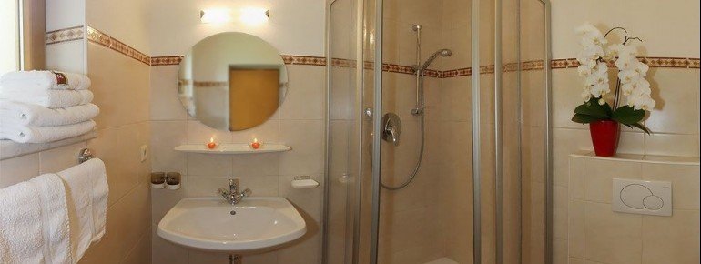 a shower with sink and toilet