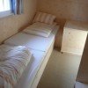 2nd bedroom with 2 single beds and storage