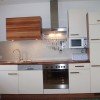 Wohnküche mit Geschirrspüler und Elektroherd