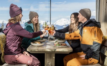 After a few action-packed runs on the Planai, it's time for a well-deserved break at one of the cozy mountain huts.