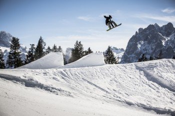 Action at terrain park Dachstein West: professional shapers groom the park for beginners and intermediates.