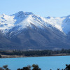 View of the glacial lake Ohau with Ohau ski field in the background.