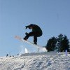 Snowboarders enjoy the integrated fun park in the skiing area