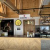 The interior of the hut is bright and modern. There is a self-service counter on site.