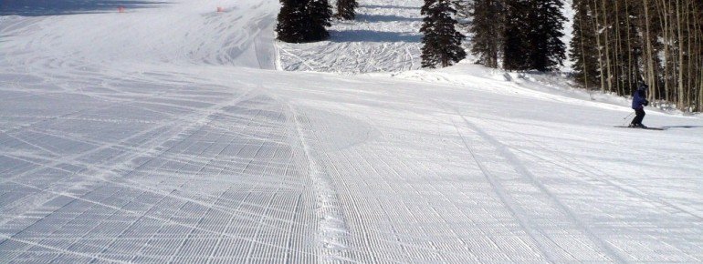 Perfectly groomed slopes are surrounded by moguls