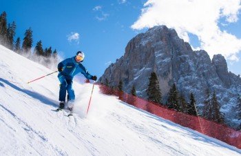 skiing on the famous Saslong slope in Val Gardena