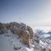 From the rooftop terrace of the mountain station, you have a fantastic panoramic view and can also see the golden summit cross of the Zugspitze.